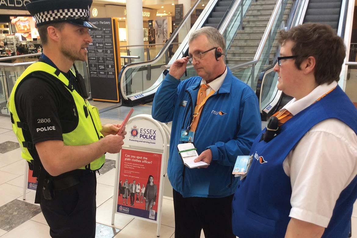 Project Servator officer speaks to retail security staff