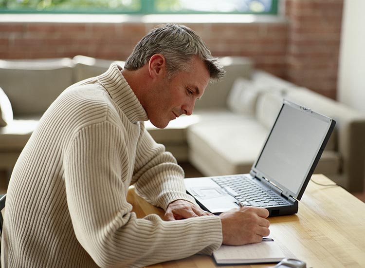 man working at home at desk